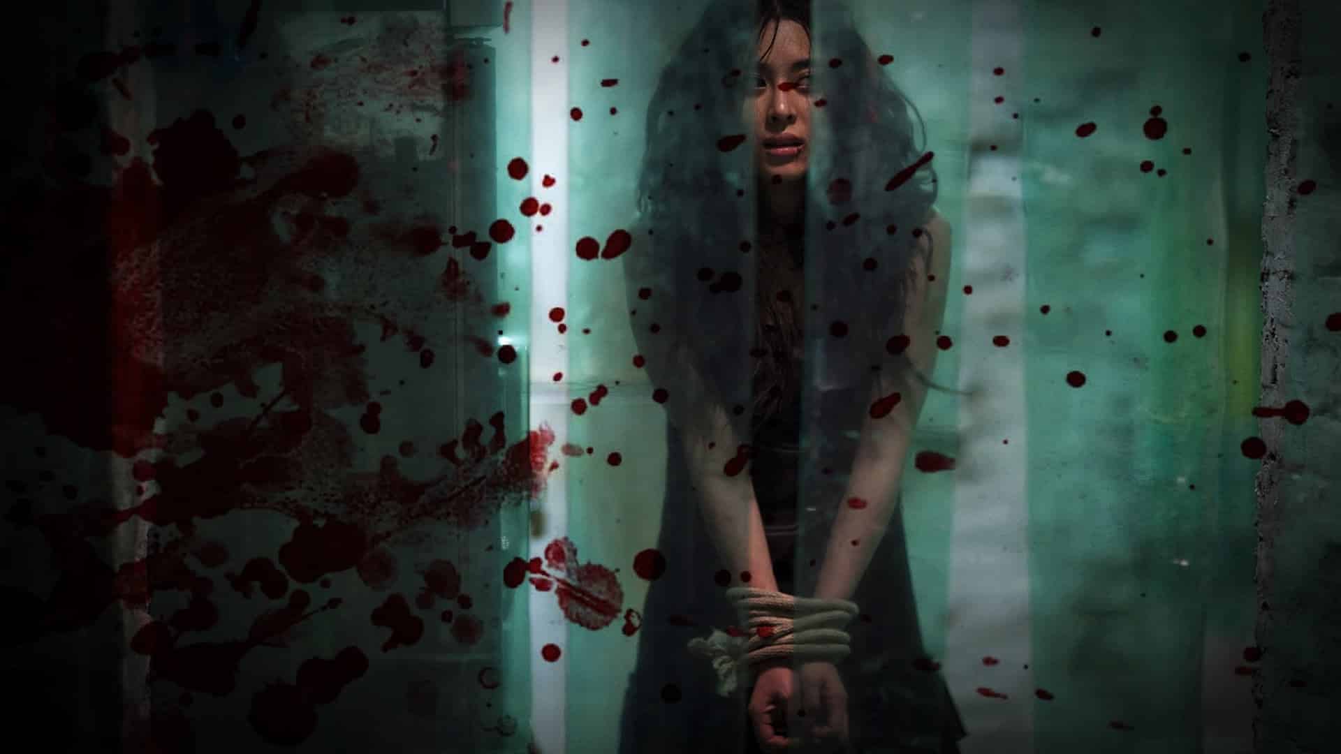 #31DaysofHalloween - I Saw the Devil (2010) - A bound woman stands, terrified behind a bloody curtain